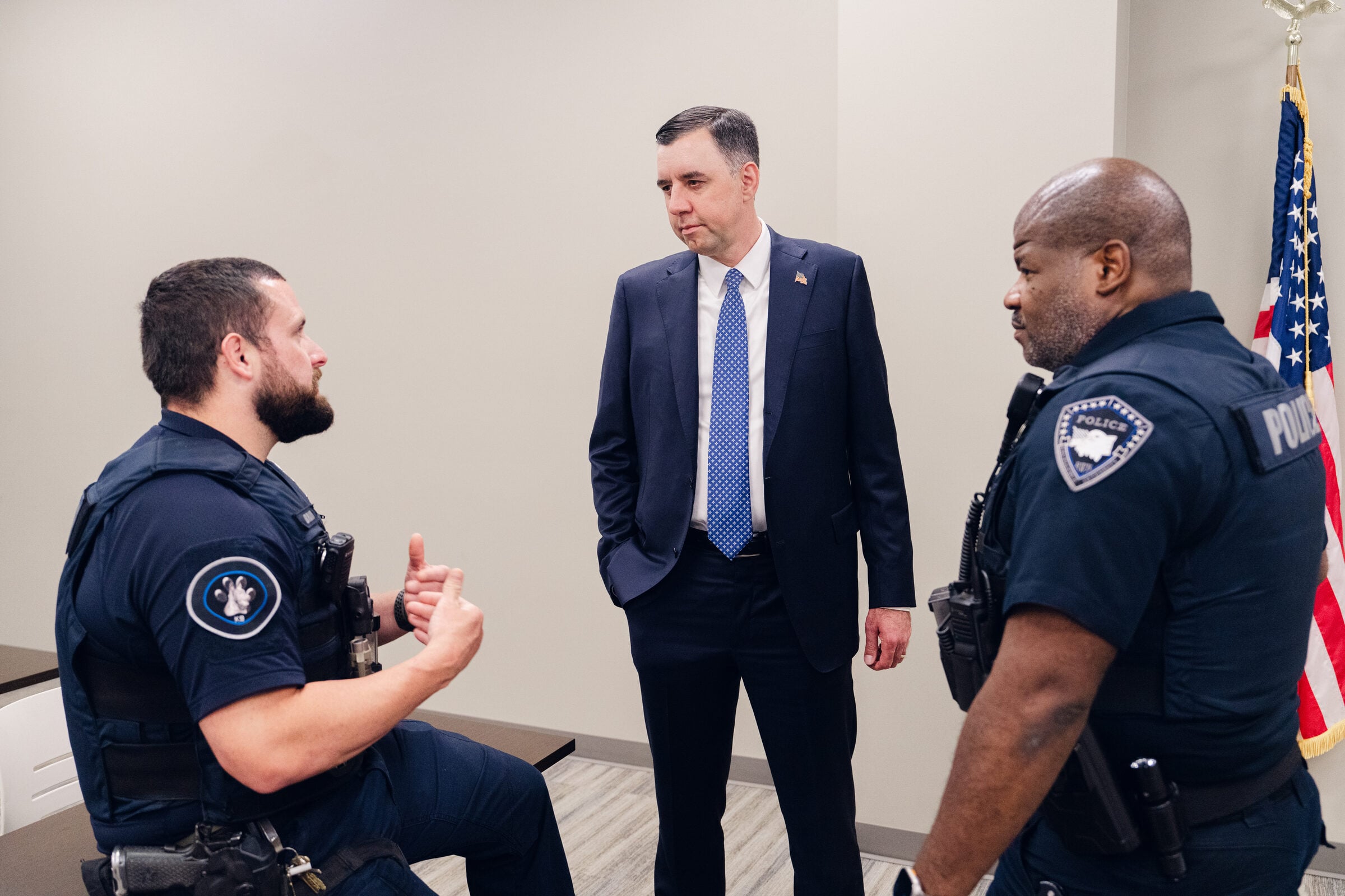 Jay Mitchell talking with police officers